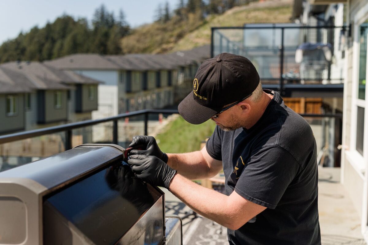 Richard Major polishing a BBQ with professional care